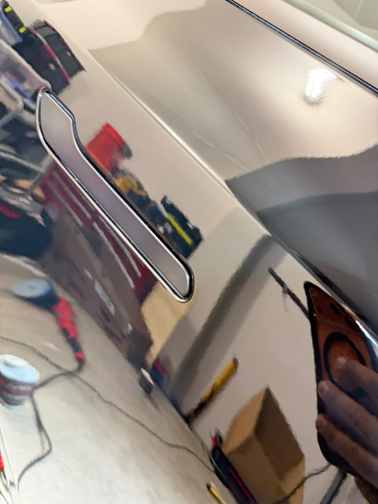 Tesla after detailing with deep gloss and a restored finish